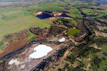 Fototapeta premium Heart-shaped lake. Lakes of sulphatic or solfatara in Pomezia. Millennia of history near Rome. Sulfide lakes
