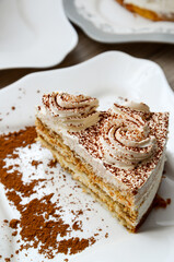 Piece of butter cream cake with a chocolate chips