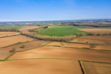Fototapeta na wymiar Aerial photo of a beautiful farmers field in the spring time in the town of Wetherby in Leeds in the UK taken in the Spring time