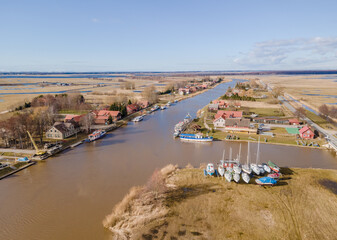 Minija or Minge (Lithuanian Venice) is a small unique fishermen's village in Lithuania on Minija river, and is part of Nemunas Delta Regional Park. It's unique as a main street is river