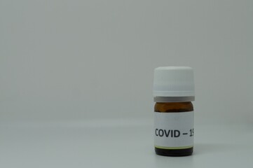 a canister of a covid vaccine with white background 