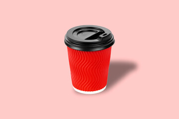 Red paper cup for drinks. Eco cup on a pink background. Mockup for your advertisement