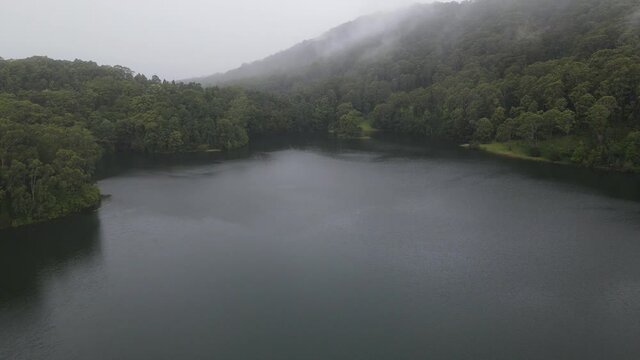 Calm Water And Lush Vegetation With Fog At Karangi Dam. Lake Karangi In Coffs Harbour, NSW, Australia. aerial drone