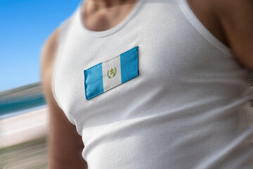 The national flag of Guatemala on the athlete's chest