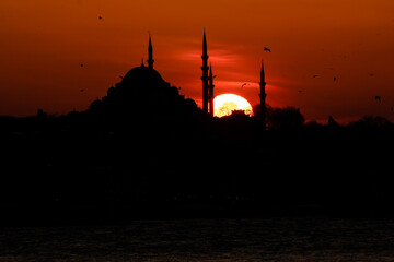 Silhouette of Suleymaniye Mosque at Sunset. Ramadan, kandil and iftar background photo. Islamic...