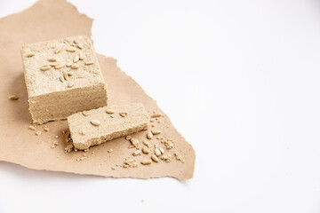 sunflower halva on a white table with seeds