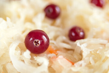 Sauerkraut with cranberries close-up. Fermented vegetables. Super product for proper nutrition. Closeup.
