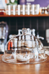 one last meringue under a glass cover in a shop window. Lack of choice