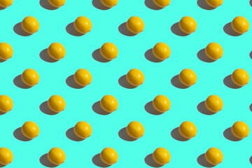 Yellow lemon on a blue background. Lemon pattern on a blue background background. Hard shadows