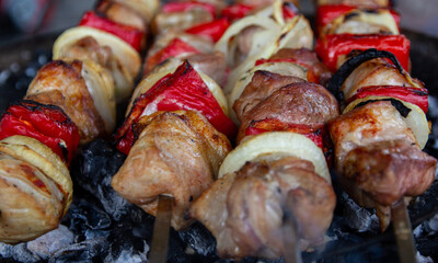 Skewers with red pepper and onion stir-fried on charcoal barbecue
