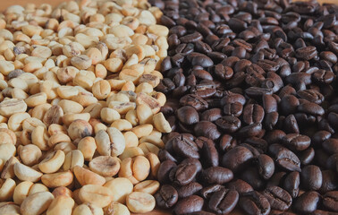 A pile of fresh coffee beans on wooden background.