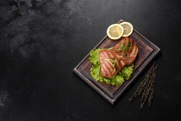 Delicious juicy tuna steak grilled with spices and herbs