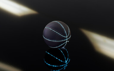 Illuminated basketball on floor