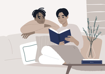 Fototapeta na wymiar Weekend leisure activities, a gay couple reading a book together in the living room, cozy domestic life during the lockdown