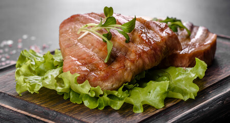 Delicious juicy tuna steak grilled with spices and herbs