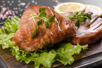 Delicious juicy tuna steak grilled with spices and herbs