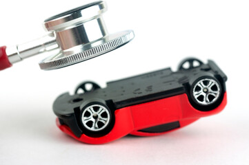 a stethoscope and a car concept of repair and diagnostics of the car