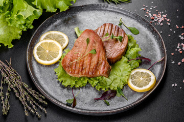 Delicious juicy tuna steak grilled with spices and herbs