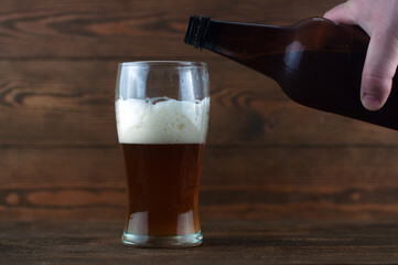 a glass of beer and a bottle in