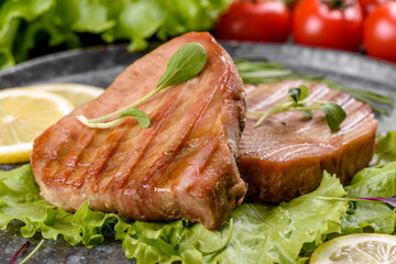 Delicious juicy tuna steak grilled with spices and herbs
