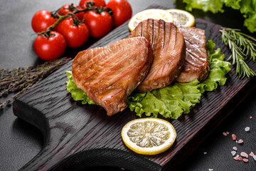 Delicious juicy tuna steak grilled with spices and herbs
