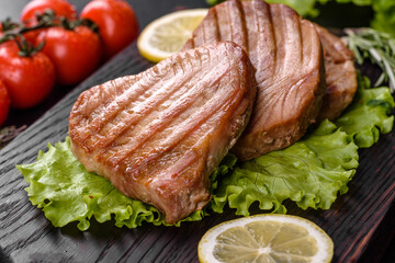 Delicious juicy tuna steak grilled with spices and herbs