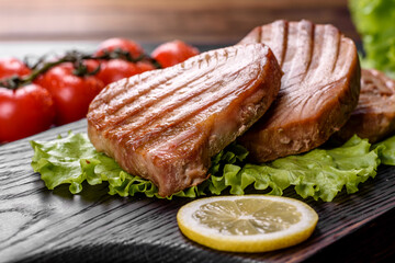Delicious juicy tuna steak grilled with spices and herbs