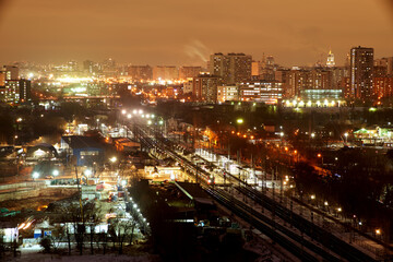 Fototapeta na wymiar Trains and the Moscow skyline. Moscow, Russia. Desember 23 2020: Trains and the Moscow skyline. Ostankino railway platform.
