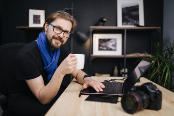 Photographer working on laptop