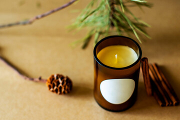 wick candles. Handmade candle from paraffin and soy wax in glass with flowers and leaf on craft background. Let flay. Candle making. Top view.