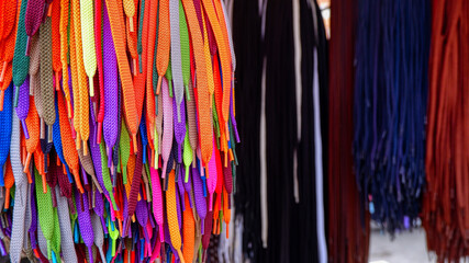 Bright colorful shoelaces at a street market in Valencia