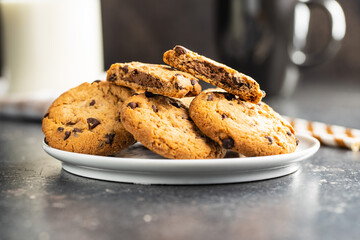 Tasty biscuits with chocolate. Sweet chocolate cookies on plate.