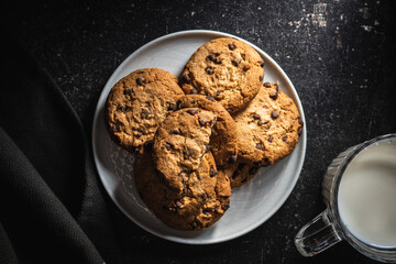 Tasty biscuits with chocolate. Sweet chocolate cookies on plate.