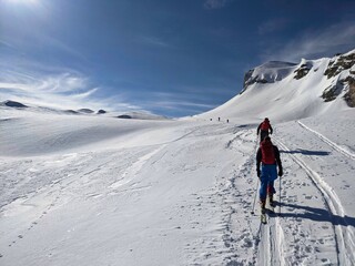 Fototapeta na wymiar Mountaineering in the alps of glarus. Ski tour in the swiss mountains. Winter landscape. Schilt. Wonderful day. Winter Sport
