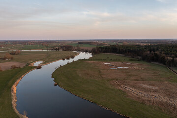 Fototapeta na wymiar aerial view on landscape with river at sunset