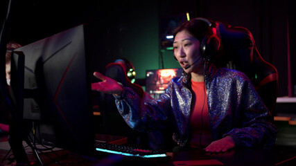 During an esports online first face shooter tournament, a gamer girl nervously plays, loses, and...