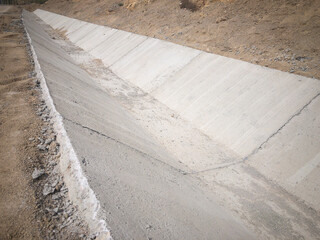 Concrete rain water drainage tray at construction site. Rain water drainage gutter. Concrete...