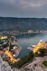 Kotor Bay and Old Town illumiinated at dusk seen from St John's Fortress and hilltop,Montenegro,Eastern Europe.