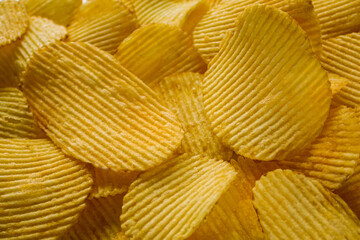 Delicious potato fluted chips for the whole background.