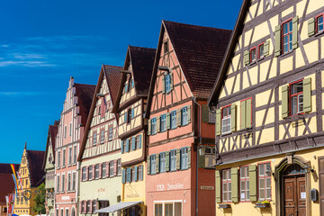 Fototapeta na wymiar DINKELSBUHL, GERMANY, 27 JULY 2020: Colorful and ancient half-timbered houses in the historic center