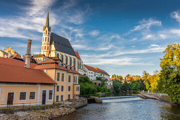 Amazing landscape of the church and the river of Cesky Krumlov at sunset in Czech Republic