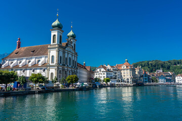 Fototapeta na wymiar LUCERNE, SWITZERLAND, 8 AUGUST 2020: beautiful view of the Lucerne church and the river
