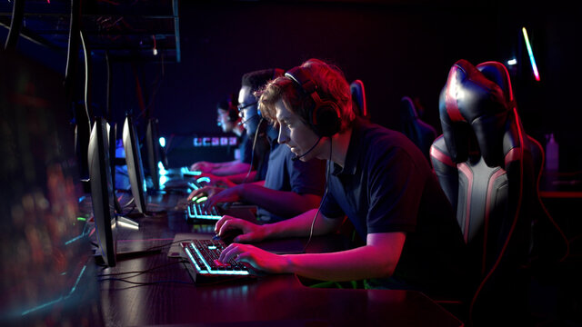 Professional esports players at an online game tournament. The cyber team plays computers and trains