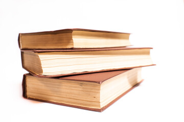 Three old vintage books isolated on white background