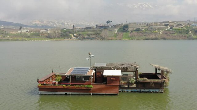Self Sufficient floating house with solar panels, Aerial view.
