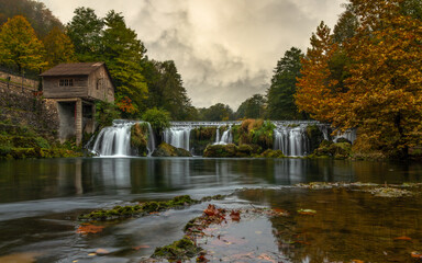 autumn by the old mill and waterfalls