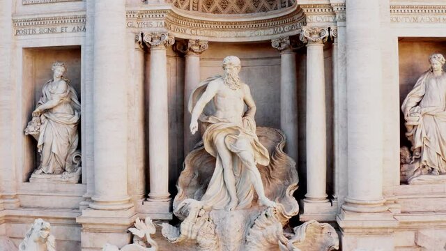 Aerial view of the Trevi Fountain or Fontana di Trevi, baroque monument in the center city of Rome, Italy. Famous tourist attraction in Roma, Italia seen from drone flying in the sky