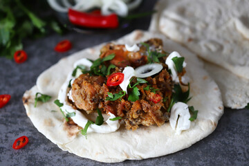 Meat on pita bread. Vegetables and pickles. Ramadan concept. Turkish and Arabic dish. Kebab on pitta lavash.