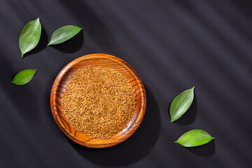 Medicago sativa - Organic alfalfa seeds in the wooden bowl