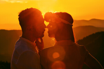 Beautiful couple walking on the mountain during sunset.